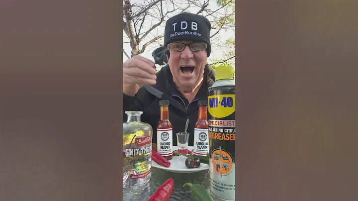 Guy eats hot peppers covered in hot sauce...
